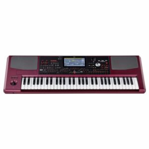 Clavier électronique Korg rouge avec écran LCD central, touches blanches et noires, haut-parleurs intégrés et commandes intuitives.