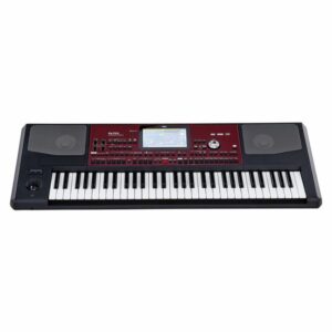 Clavier arrangeur noir et rouge avec écran central et haut-parleurs intégrés idéal pour la création musicale professionnelle.