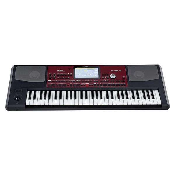Clavier arrangeur noir et rouge avec écran central et haut-parleurs intégrés idéal pour la création musicale professionnelle.