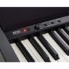 Clavier de piano numérique XE20 avec boutons de réglage et touches noires et blanches en gros plan, lumière rouge allumée.