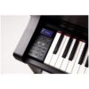 Clavier numérique noir avec écran LCD et boutons de contrôle, touches blanches et noires en gros plan, modèle Clavinova.
