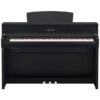 Piano numérique noir Yamaha, design élégant, 88 touches et trois pédales, idéal pour musiciens et étudiants en musique.