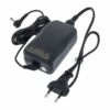 Adaptateur secteur noir avec fiche européenne, câble enroulé et embout de connexion. Idéal pour appareils électroniques.