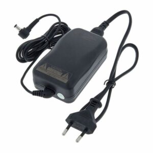 Adaptateur secteur noir avec fiche européenne, câble enroulé et embout de connexion. Idéal pour appareils électroniques.