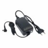 Chargeur noir avec câble et prise secteur européenne, pour alimentation d'appareils électroniques, sur fond blanc.