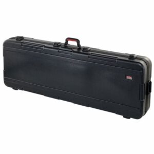 Valise noire rigide pour rangement et transport sécurisé d'instruments de musique, avec poignée robuste.