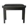 Tabouret de piano noir moderne avec siège rembourré, idéal pour musiciens et déco intérieure élégante.