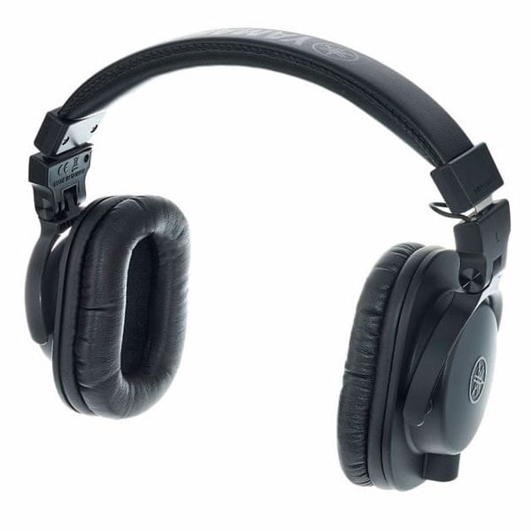 Casque audio noir professionnel avec coussinets rembourrés, bandeau ajustable et logo argenté, idéal pour le studio.