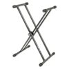 Support pliable en X pour clavier musical, en métal noir avec embouts antidérapants, ajustable pour usage pratique.