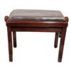 Tabouret en bois sombre avec siège rembourré recouvert de plastique, idéal pour piano ou salle de musique.
