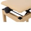 Gros plan d'un siège réglable beige avec mécanisme à molette noire, idéal pour les pianos et autres instruments de musique.